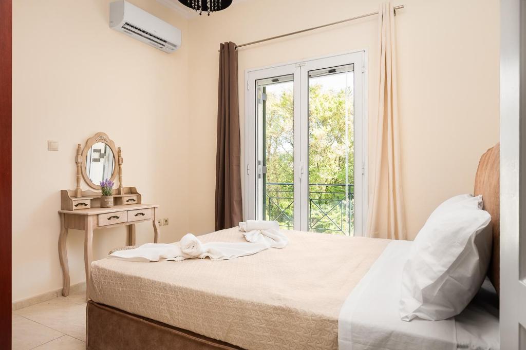 Posteľ alebo postele v izbe v ubytovaní michael apartments