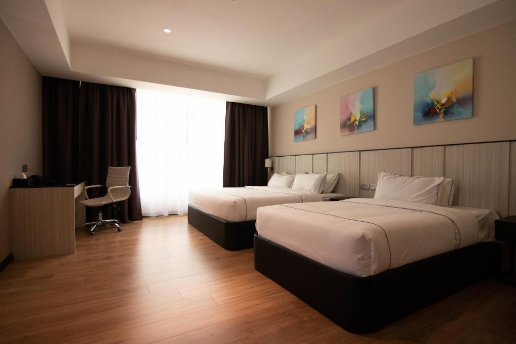 Postel nebo postele na pokoji v ubytování Higher Hotel