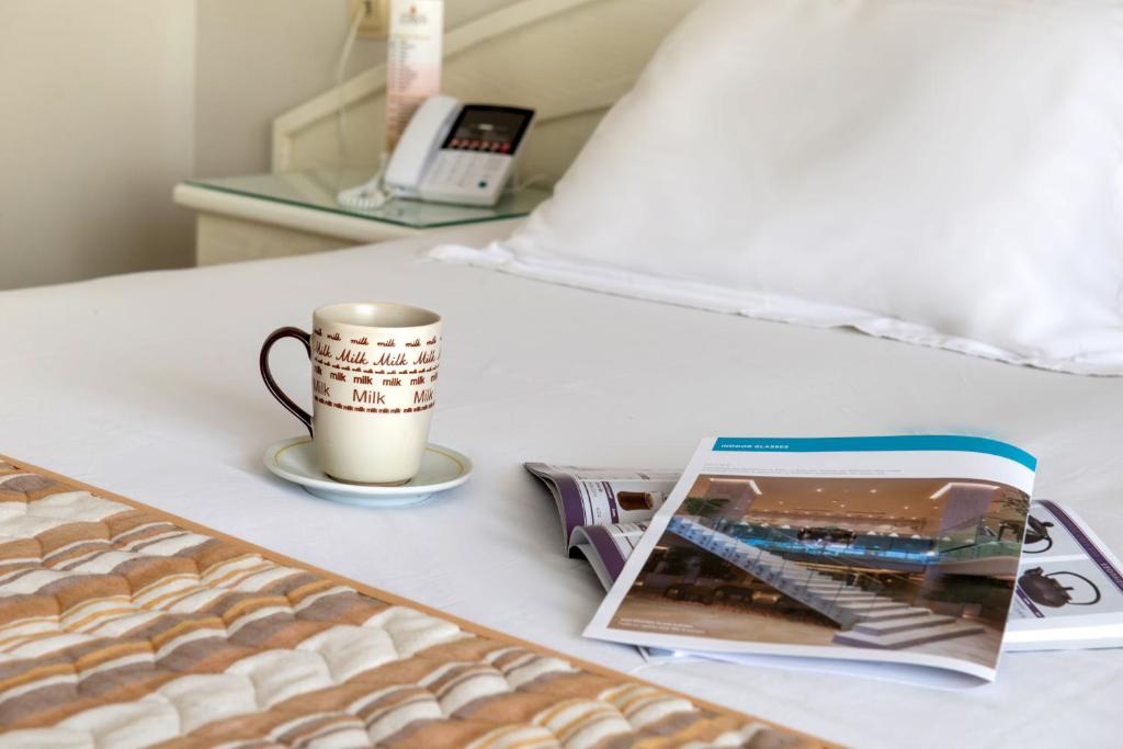 Postel nebo postele na pokoji v ubytování Hotel Strass