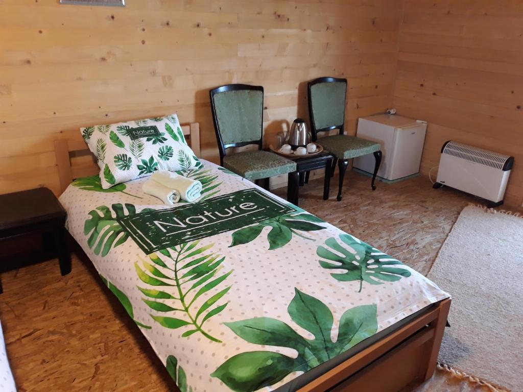Giường trong phòng chung tại Apartments in Nature