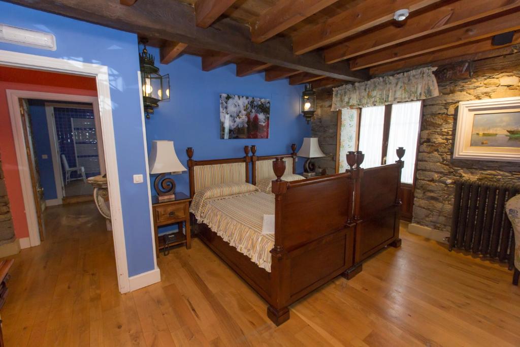 Postel nebo postele na pokoji v ubytování Hotel Rural Casa Xusto