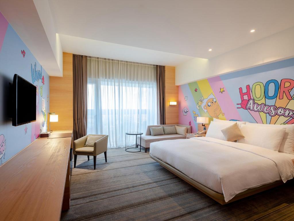 Postel nebo postele na pokoji v ubytování Hotel COZZI Ximen Tainan