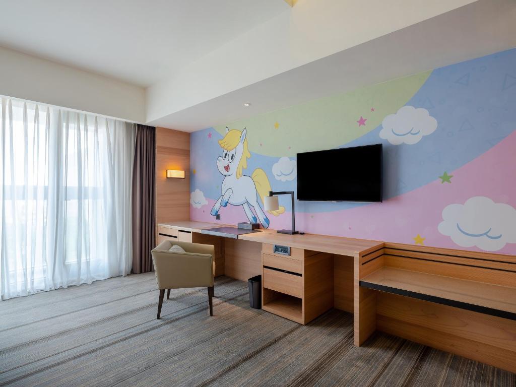 TV a/nebo společenská místnost v ubytování Hotel COZZI Ximen Tainan