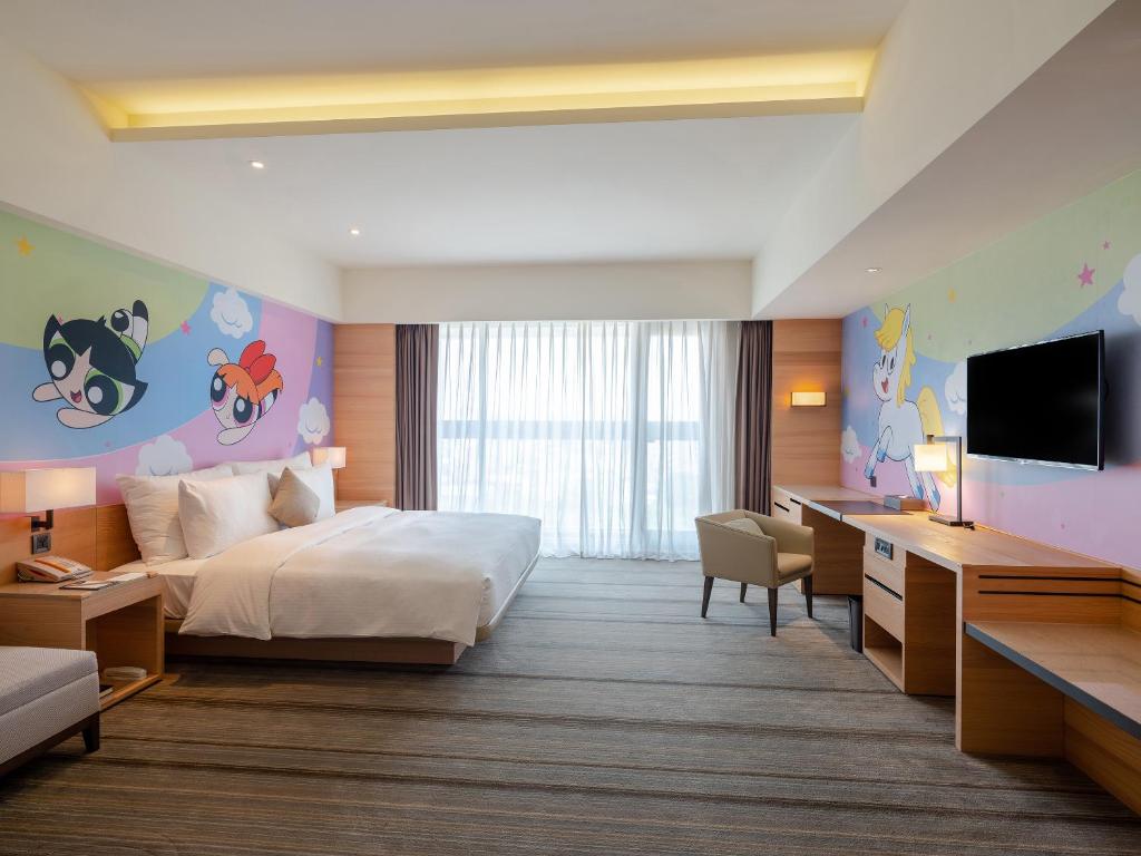 Postel nebo postele na pokoji v ubytování Hotel COZZI Ximen Tainan