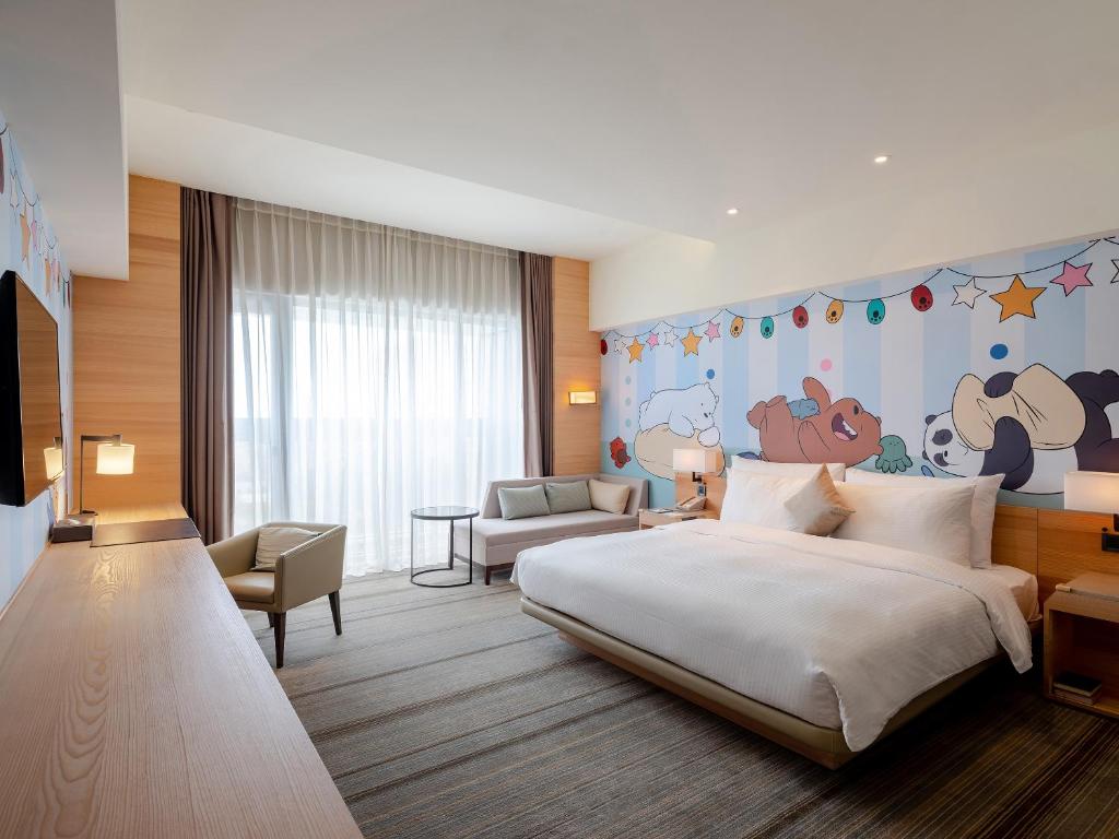 Postel nebo postele na pokoji v ubytování Hotel COZZI Ximen Tainan