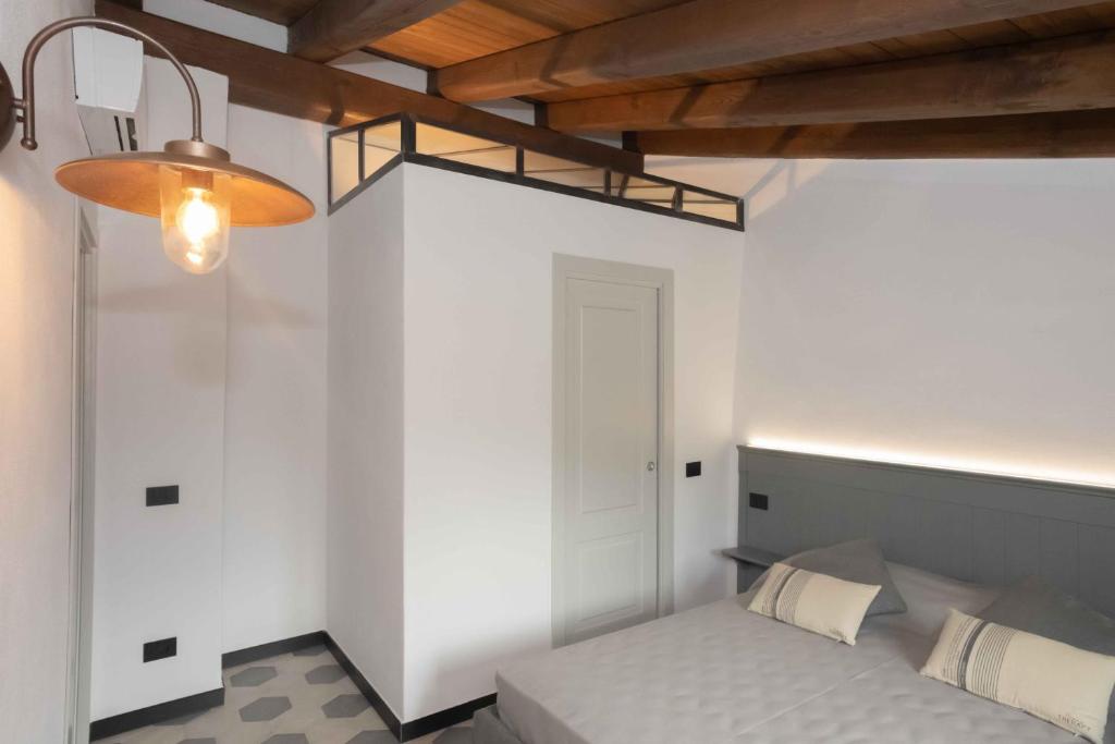 Postel nebo postele na pokoji v ubytování Agriturismo Ca Du Briccu