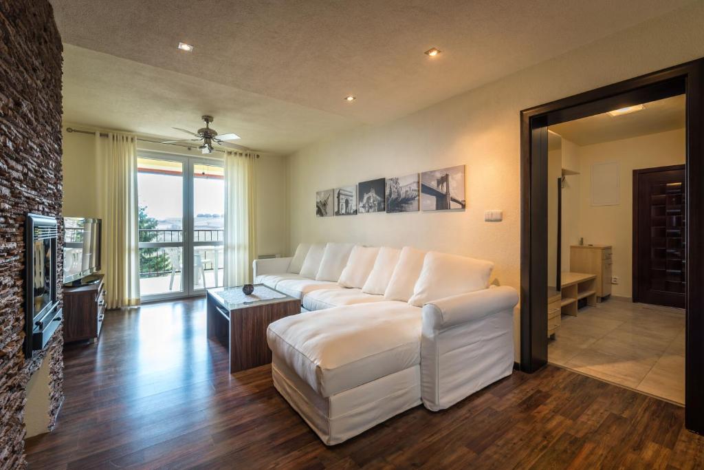 A bed or beds in a room at Classy Apartment - Telgárt Resort