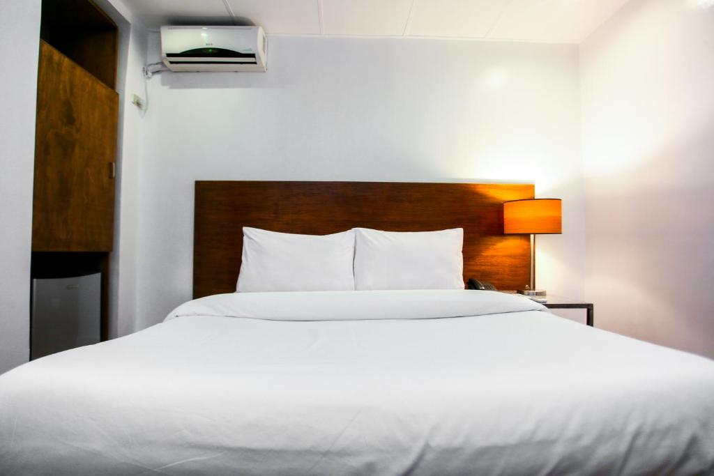 Postel nebo postele na pokoji v ubytování Hotel Durban
