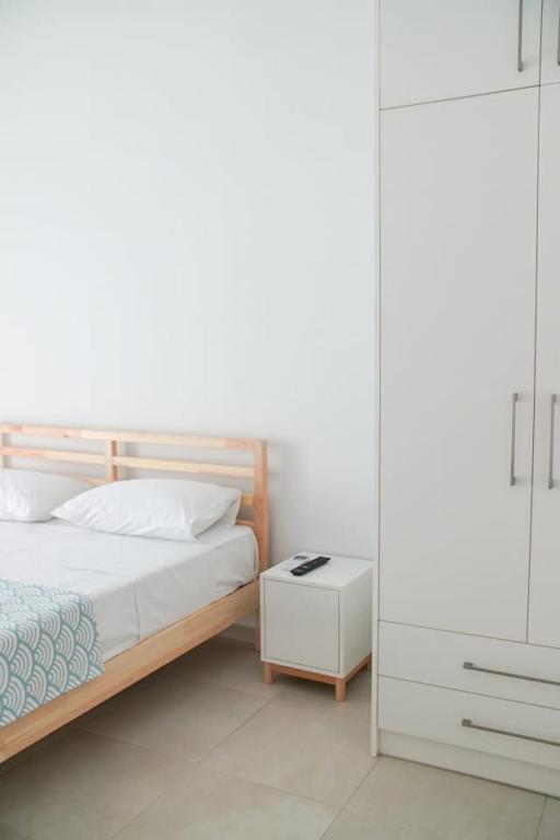 Postel nebo postele na pokoji v ubytování Legno Bianco