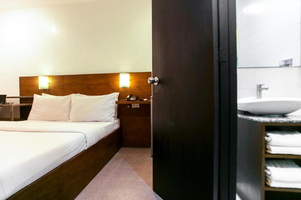 Postel nebo postele na pokoji v ubytování Hotel Durban