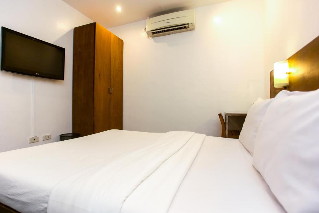 Postel nebo postele na pokoji v ubytování Hotel Durban