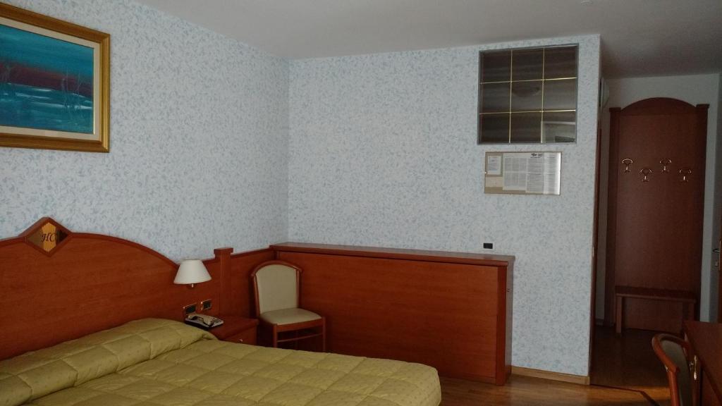 Postelja oz. postelje v sobi nastanitve Hotel Concordia