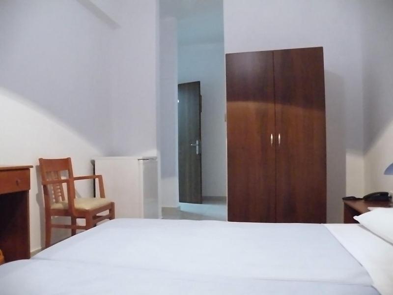 Postel nebo postele na pokoji v ubytování Hotel Alexandros