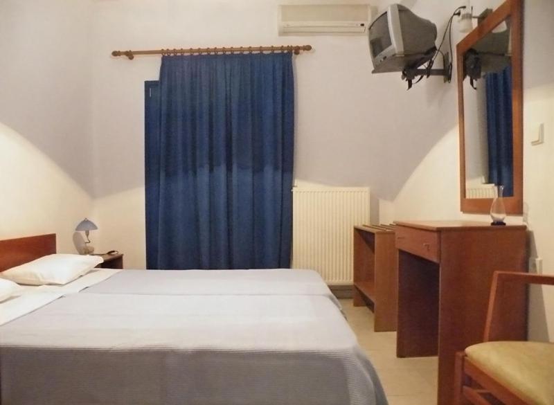 Postel nebo postele na pokoji v ubytování Hotel Alexandros