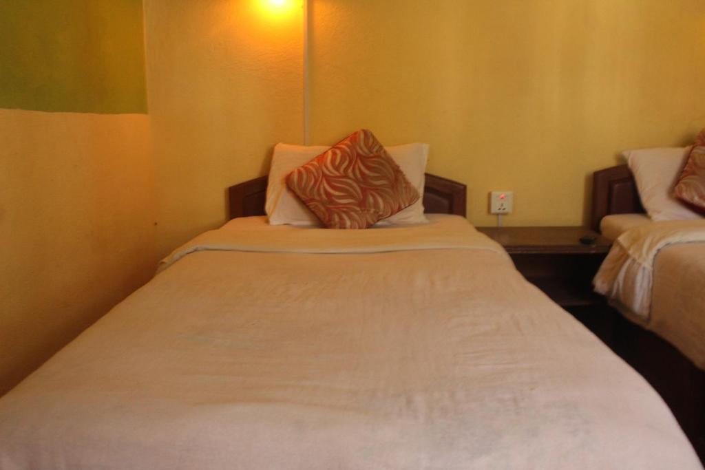 Postel nebo postele na pokoji v ubytování Hotel Vision