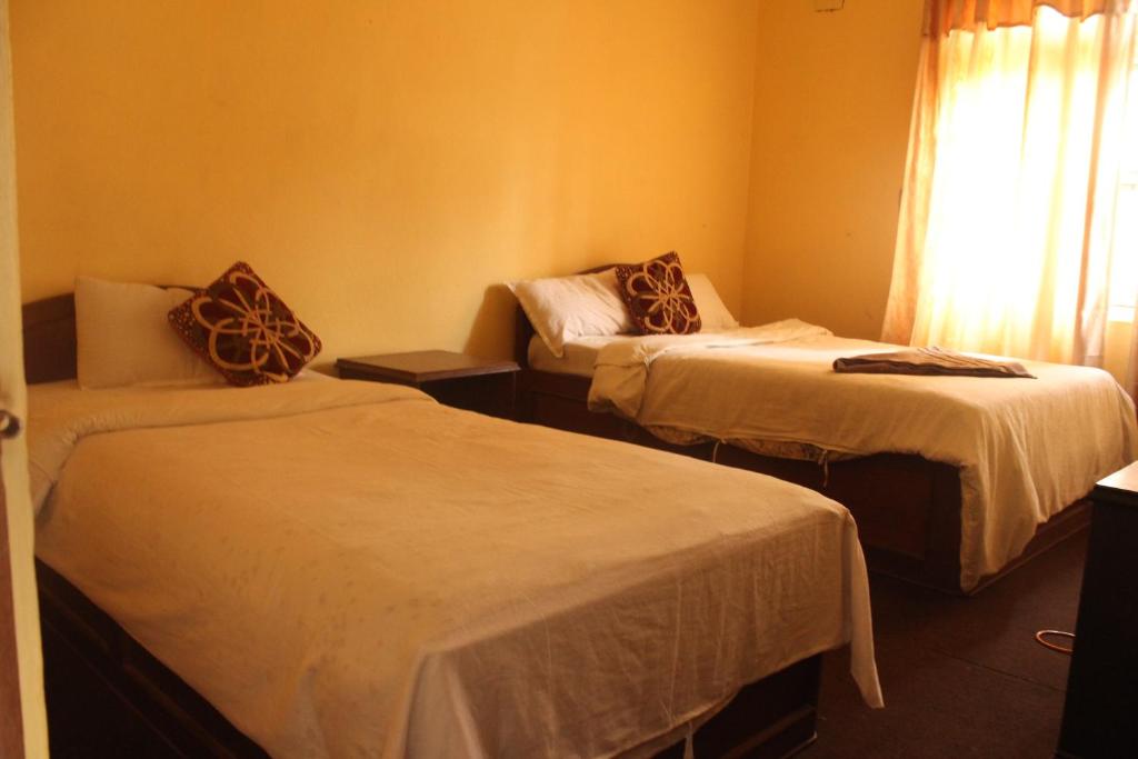 Postel nebo postele na pokoji v ubytování Hotel Vision