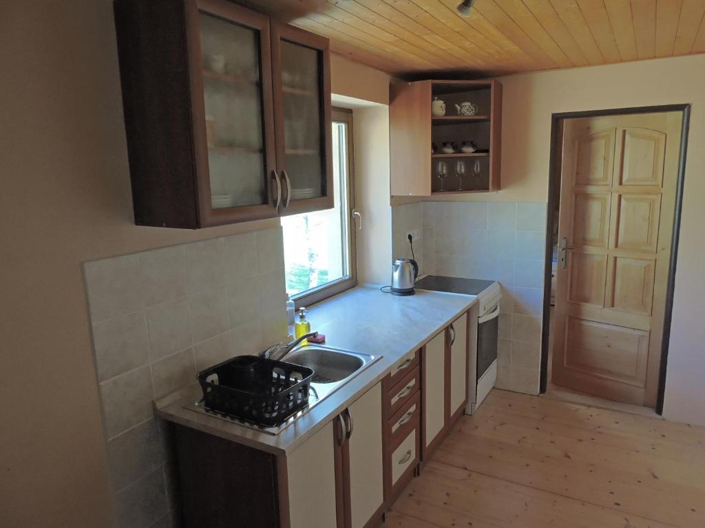 Kuchyň nebo kuchyňský kout v ubytování Apartmány Na Lontě
