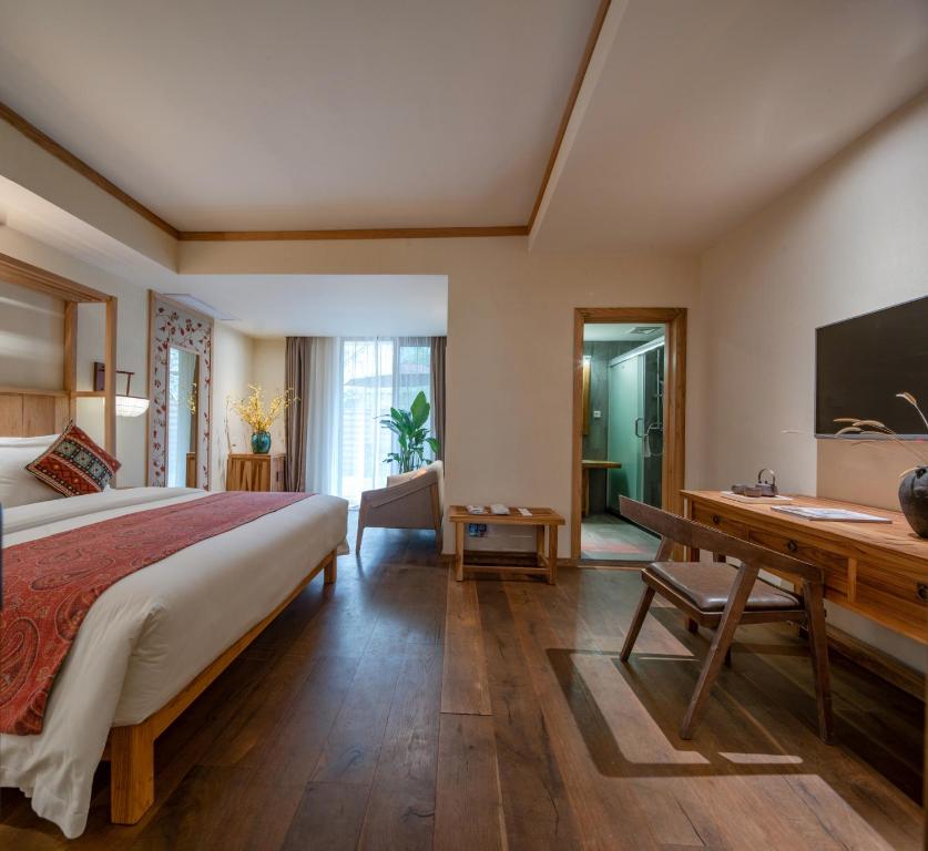 Postel nebo postele na pokoji v ubytování The Apsara Lodge