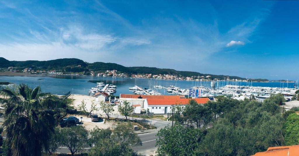 a marina with a bunch of boats in the water at B&B Garni Stefi! in Supetarska Draga