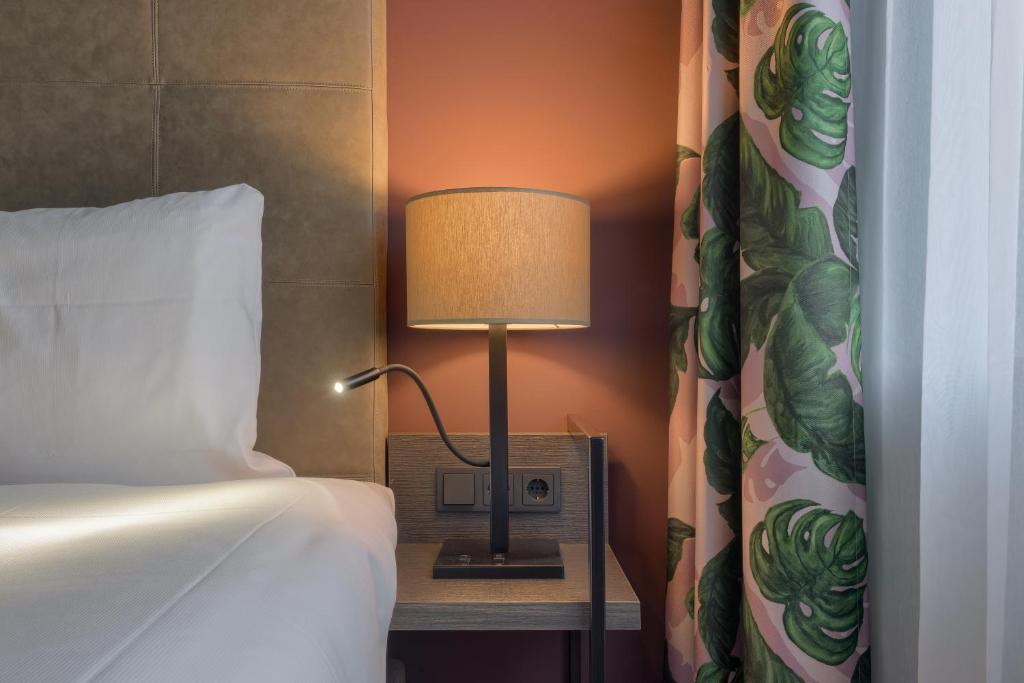 Postel nebo postele na pokoji v ubytování Hotel Restaurant Grandcafé 't Voorhuys