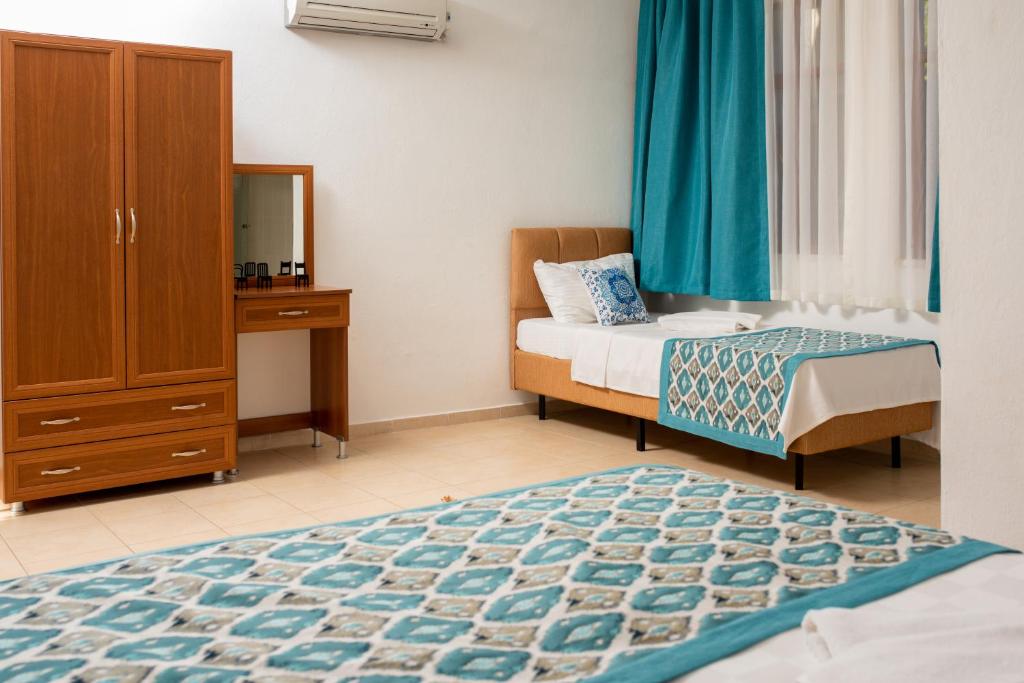 Postel nebo postele na pokoji v ubytování San Simon Hotel