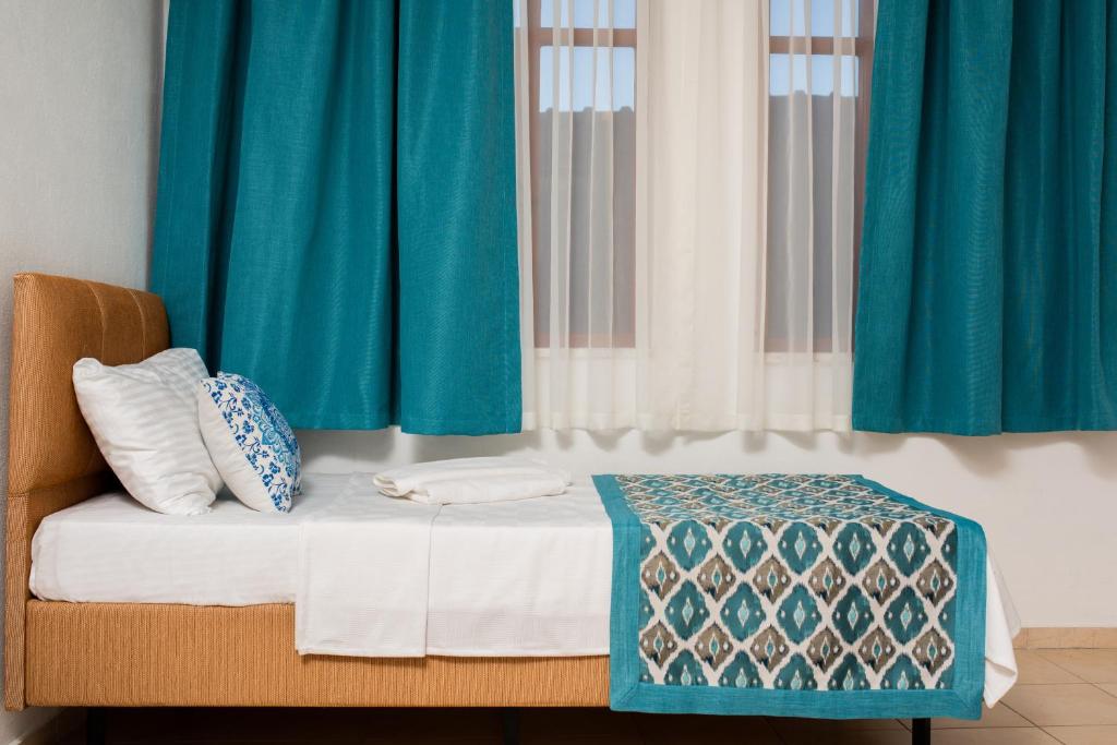 Postel nebo postele na pokoji v ubytování San Simon Hotel