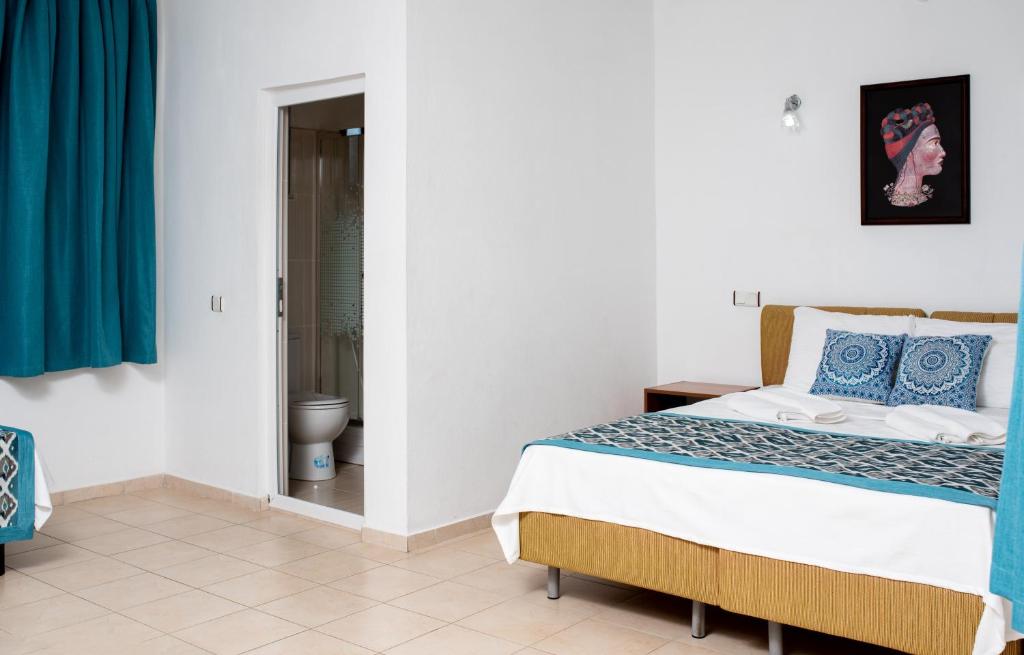Postel nebo postele na pokoji v ubytování San Simon Hotel