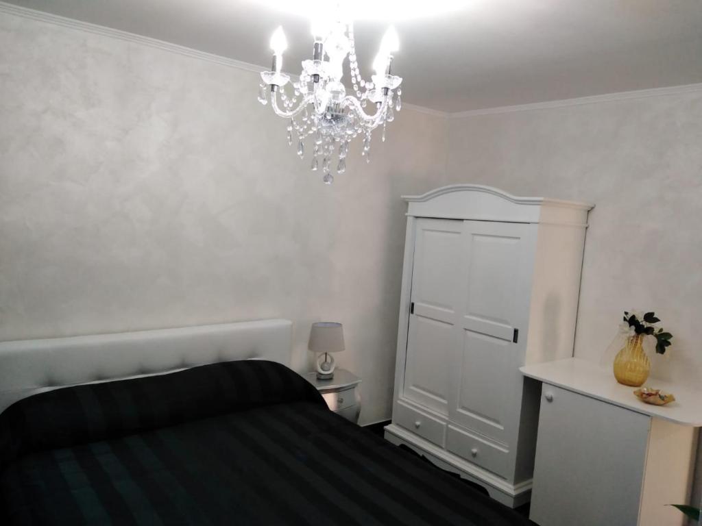 Postel nebo postele na pokoji v ubytování B&B Appartamenti l'Anfora
