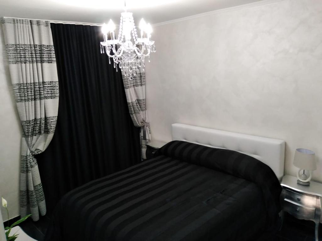 Postel nebo postele na pokoji v ubytování B&B Appartamenti l'Anfora