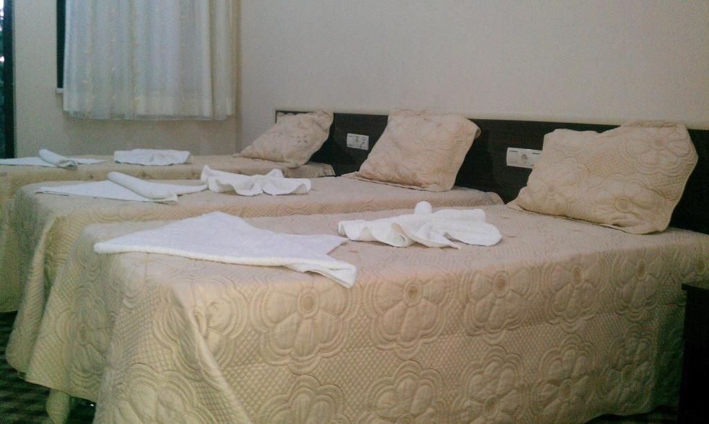 Postel nebo postele na pokoji v ubytování Anatolia Hotel