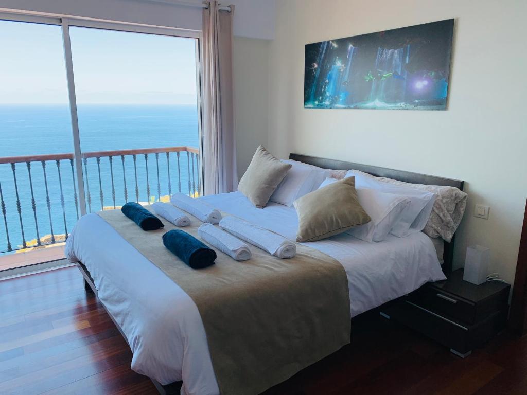 Posteľ alebo postele v izbe v ubytovaní Villa OCEAN Infinity heated pool optional
