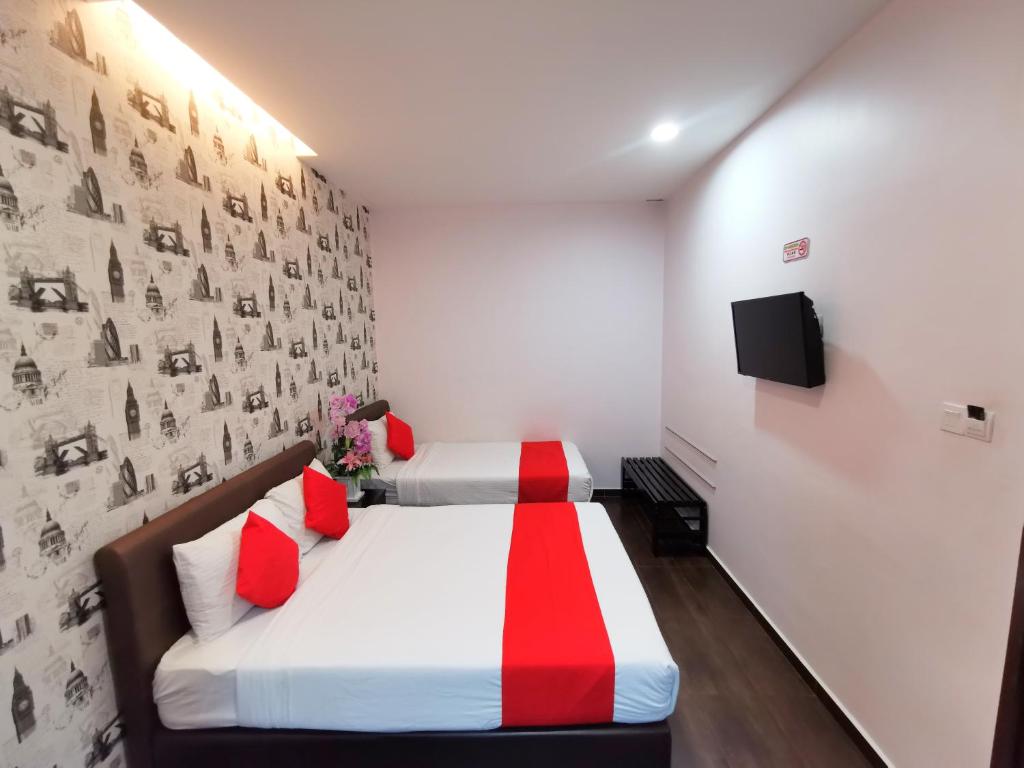 Postel nebo postele na pokoji v ubytování Palazzo Hotel Kulai