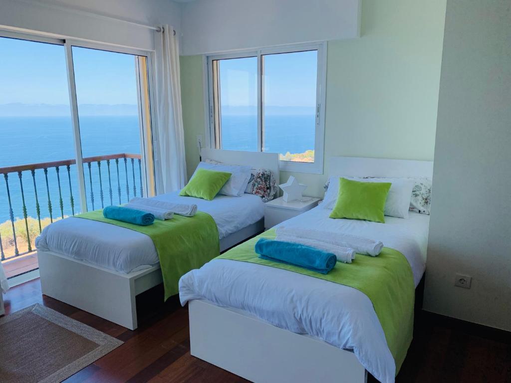 Posteľ alebo postele v izbe v ubytovaní Villa OCEAN Infinity heated pool optional