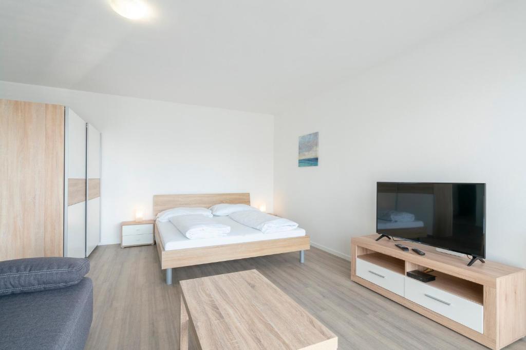Posteľ alebo postele v izbe v ubytovaní Apartmány Noviny