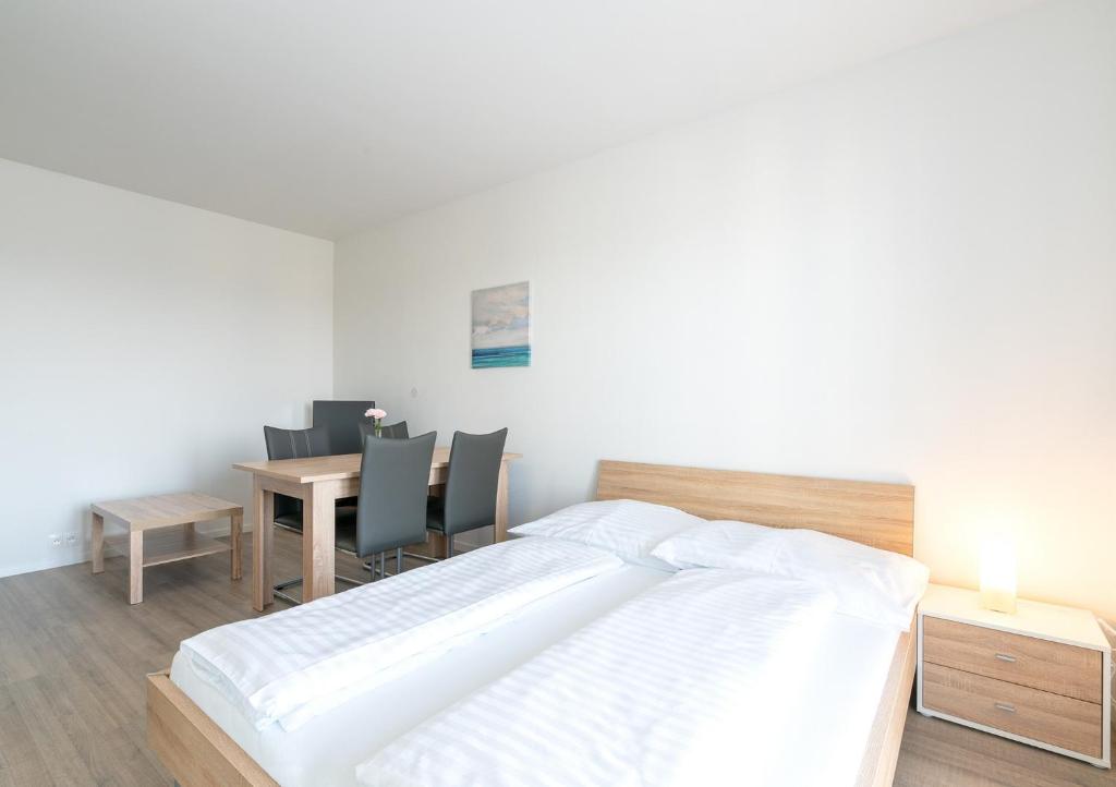 Posteľ alebo postele v izbe v ubytovaní Apartmány Noviny