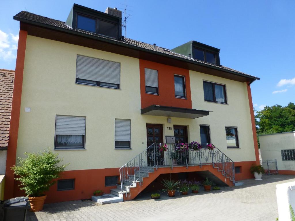 a house with a staircase in front of it at Apartment Nürnberg in Nuremberg