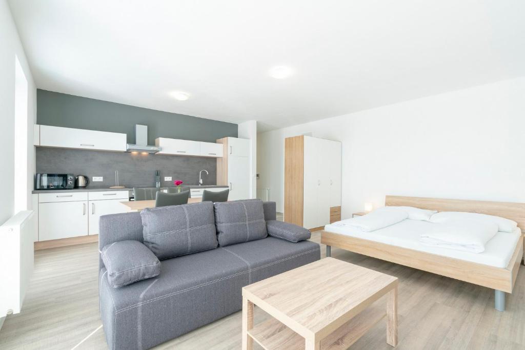 Posteľ alebo postele v izbe v ubytovaní Apartmány Noviny