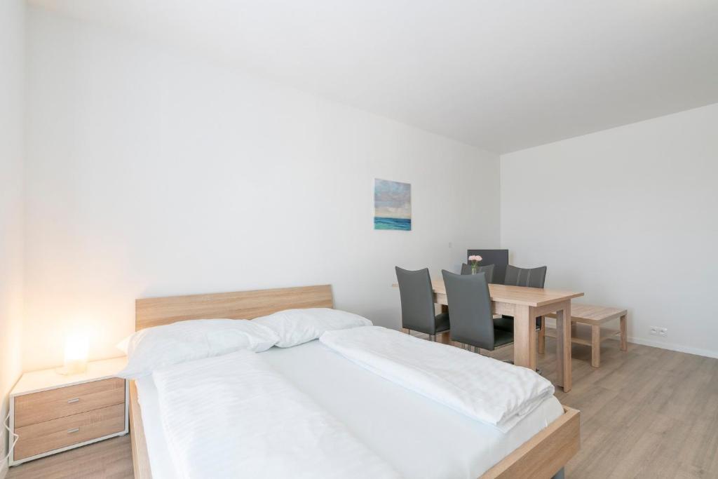 Posteľ alebo postele v izbe v ubytovaní Apartmány Noviny