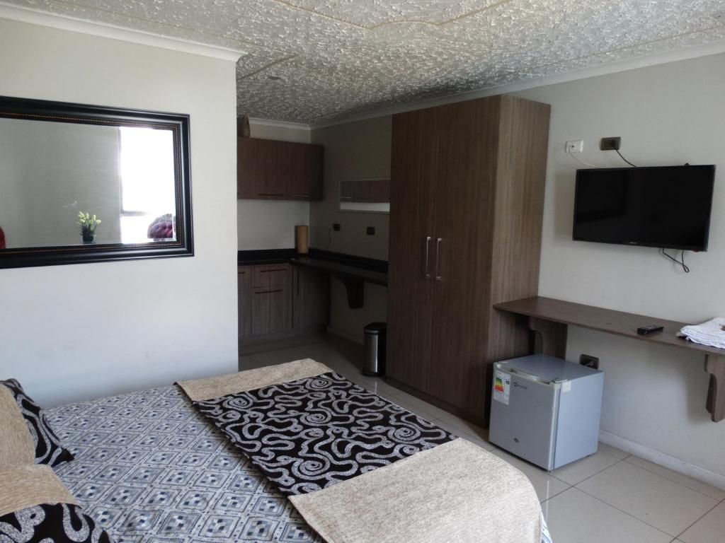 TV a/nebo společenská místnost v ubytování Hostal Quinta Normal
