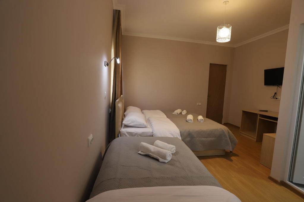 Postel nebo postele na pokoji v ubytování Hotel Hollywood