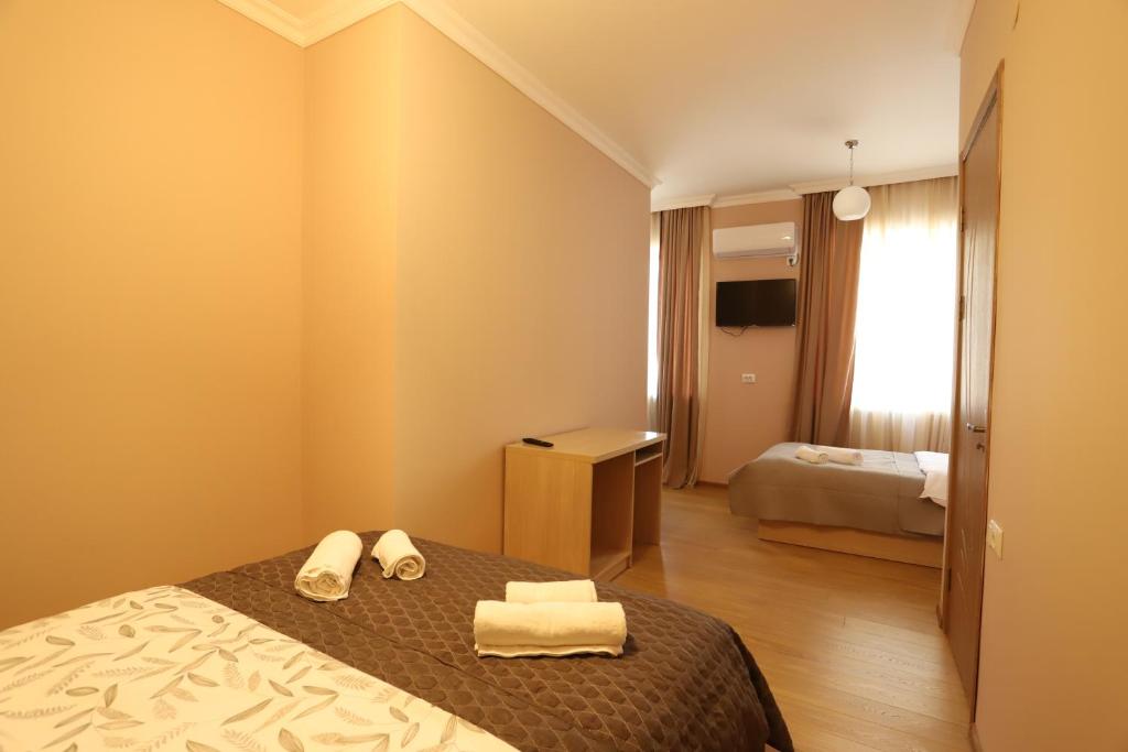 Postel nebo postele na pokoji v ubytování Hotel Hollywood