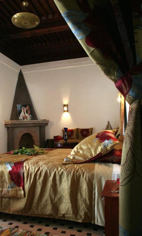 Postel nebo postele na pokoji v ubytování Riad Tahar Oasis
