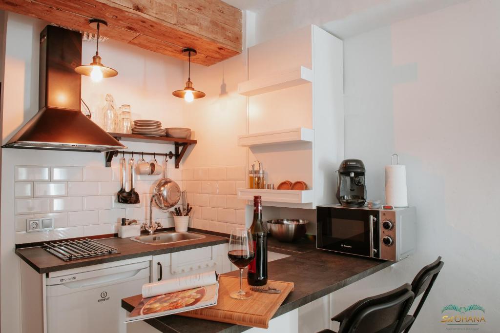 Kuchyňa alebo kuchynka v ubytovaní Sol Ohana Apartamento Boutique