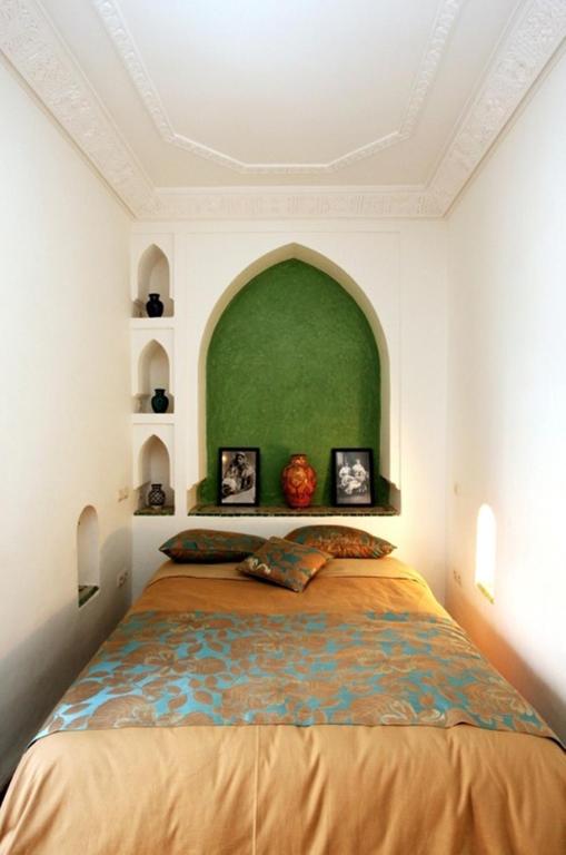 Postel nebo postele na pokoji v ubytování Riad Tahar Oasis