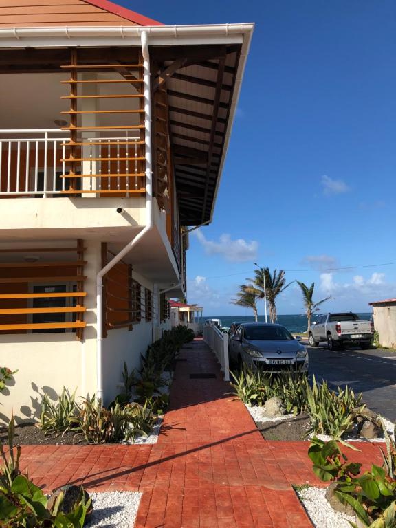 a house with a view of the ocean at Appartement résidentiel in Le Moule