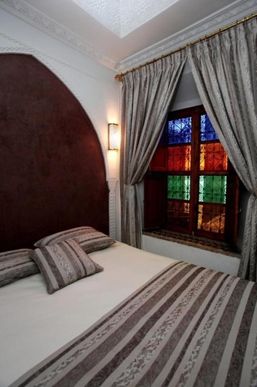 Postel nebo postele na pokoji v ubytování Riad Tahar Oasis