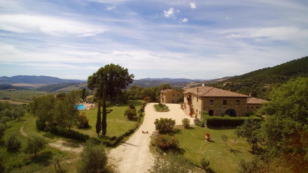 an aerial view of a house and a road in a field at Villa Le Bolli in Radicondoli