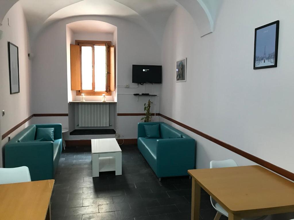 Televízia a/alebo spoločenská miestnosť v ubytovaní Albergue las Veletas