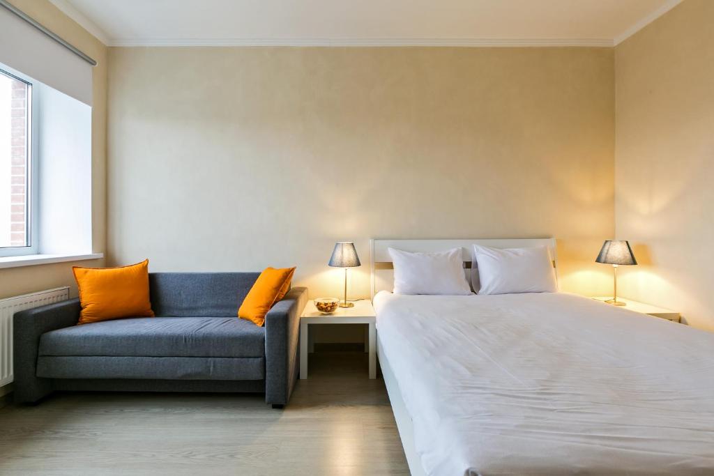 En eller flere senge i et værelse på LASPACE PRIMA Apartments