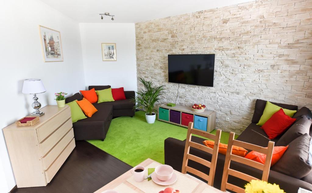 Televízia a/alebo spoločenská miestnosť v ubytovaní APARTAMENT CENTRUM - 2 z miejscem parkingowym